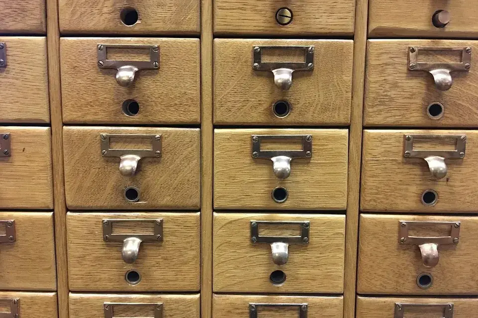 Wooden card-index drawers with brass label holders